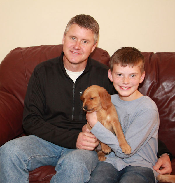 Family and puppy going home