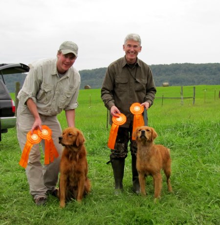 proud owners and dogs with ribbons