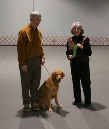 Penny and Jim with judge and ribbon